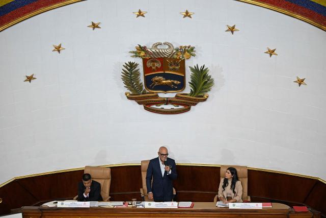 Venezuela's National Assembly President Jorge Rodriguez (C) speaks next to First Vice President Pedro Infante (L) and Second Vice President Grecia Colmenares during an ordinary session at the National Assembly in Caracas on June 2, 2026. Venezuela’s parliament began debating a reform that opens the door to private capital to help restore the state-controlled power system. (Photo by Federico PARRA / AFP)