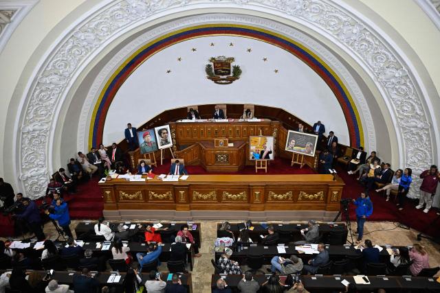 Lawmakers attend a debate during an ordinary session at Venezuela’s National Assembly in Caracas on June 2, 2026. Venezuela’s parliament began debating a reform that opens the door to private capital to help restore the state-controlled power system. (Photo by Federico PARRA / AFP)