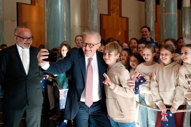 Solomon Islands Prime Minister Matthew Wale (L) reacts as Australia’s Prime Minister Anthony Albanese (C) poses for a selfie with student Matteo Albanese at Parliament House in Canberra on June 3, 2026. (Photo by Hilary Wardhaugh / AFP)