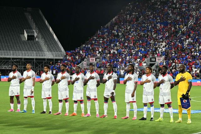 The Haiti national team stands for their national anthem before an international friendly football match between Haiti and New Zealand at Chase Stadium in Fort Lauderdale, Florida on June 2, 2026. (Photo by CHANDAN KHANNA / AFP)