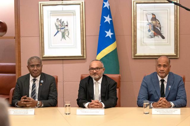 Solomon Islands' Prime Minister Matthew Wale (C), Minister of National Planning and Development Coordination Peter Kenilorea (L) and Minister of Police, National Security and Correctional Services John Tuhaika attend a meeting with Australia’s Prime Minister Anthony Albanese at Parliament House in Canberra on June 3, 2026. (Photo by Hilary Wardhaugh / AFP)