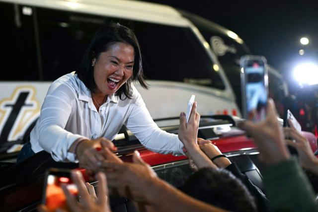 Peru's presidential candidate for the Fuerza Popular party, Keiko Fujimori, greets supporters during a campaign rally in Huacho, north of Lima, Peru, on June 2, 2026. Peruvians will choose on June 7, 2026 their president from between the right-wing Keiko Fujimori, heir to a political dynasty that divides the nation, and the left-wing Roberto Sánchez: two diametrically opposed visions for a country plagued by instability and crime. (Photo by ERNESTO BENAVIDES / AFP)