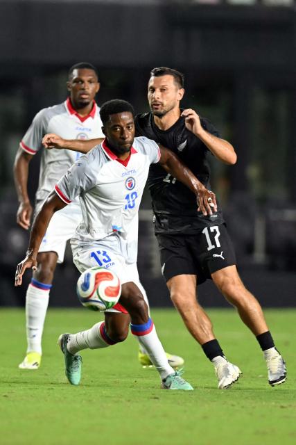 Haiti's defender #13 Markhus Lacroix and New Zealand's forward #17 Kosta Barbarouses fight for the ball during an international friendly football match between Haiti and New Zealand at Inter Miami CF Stadium in Fort Lauderdale, Florida on June 2, 2026. (Photo by CHANDAN KHANNA / AFP)