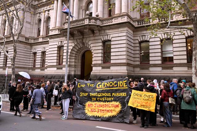 Supporters of Aboriginal elder Djuran Bunjileenee Uncle Robbie Thorpe gather outside the Victorian Supreme Court of Appeal in Melbourne on June 3, 2026. Thorpe appeared before the Victorian Supreme Court of Appeal seeking to charge Britain's King Charles III for the genocide of Aboriginal people. (Photo by William WEST / AFP)