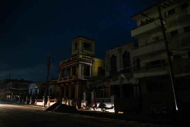 People gather on a street during a blackout in El Vedado neighbourhood in Havana on June 2, 2026. (Photo by ADALBERTO ROQUE / AFP)