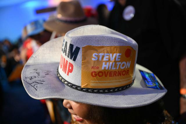 A supporter of Republican California Gubernatorial candidate Steve Hilton wears a "Team Trump" hat at his election night event in Huntington Beach, California, on June 2, 2026. Californians went to the polls Tuesday in the first round of voting for a new governor, with a tight three-way race for two run-off spots, while people in Los Angeles will also be voting for a new mayor. The state's so-called "jungle primary" pits all comers against each other -- regardless of party -- with the top two vote-getters advancing to the November general election to replace term-limited Governor Gavin Newsom. (Photo by Patrick T. Fallon / AFP)