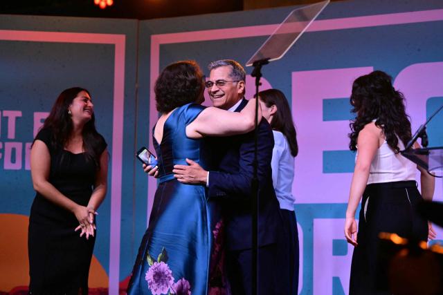 Democrat California Gubernatorial candidate Xavier Becerra hugs his wife after speaking at an election night event in downtown Los Angeles, on June 2, 2026. Californians go to the polls Tuesday in the first round of voting for a new governor, with a tight three-way race for two run-off spots, while people in Los Angeles will also be voting for a new mayor. The state's so-called "jungle primary" pits all comers against each other -- regardless of party -- with the top two vote-getters advancing to the November general election to replace term-limited Governor Gavin Newsom. (Photo by Frederic J. Brown / AFP)