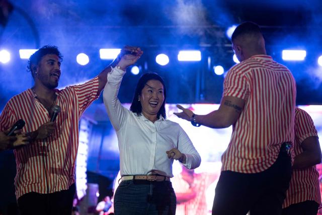 Peru's presidential candidate for the Fuerza Popular party, Keiko Fujimori, dances during a campaign rally in Huacho, north of Lima, Peru, on June 2, 2026. Peruvians will choose on June 7, 2026 their president from between the right-wing Keiko Fujimori, heir to a political dynasty that divides the nation, and the left-wing Roberto Sánchez: two diametrically opposed visions for a country plagued by instability and crime. (Photo by Ernesto BENAVIDES / AFP)