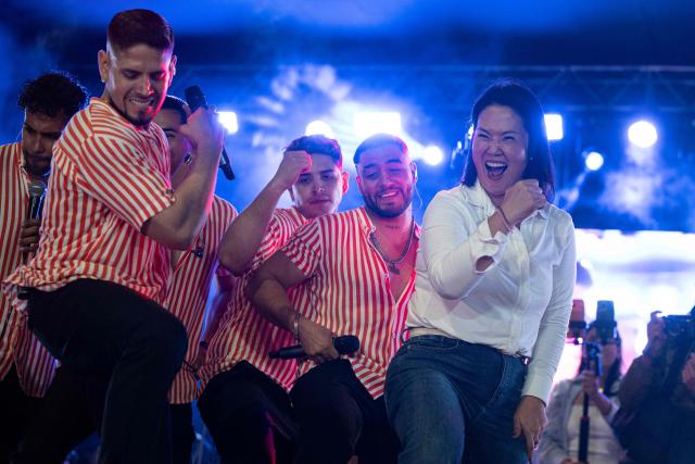 Peru's presidential candidate for the Fuerza Popular party, Keiko Fujimori, dances during a campaign rally in Huacho, north of Lima, Peru, on June 2, 2026. Peruvians will choose on June 7, 2026 their president from between the right-wing Keiko Fujimori, heir to a political dynasty that divides the nation, and the left-wing Roberto Sánchez: two diametrically opposed visions for a country plagued by instability and crime. (Photo by Ernesto BENAVIDES / AFP)