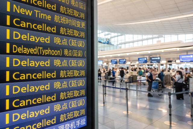 The flight board is seen at the International Terminal at Haneda airport after flights were cancelled or severely delayed because of severe tropical storm Jangmi in Tokyo on June 3, 2026. A severe tropical storm moved towards Tokyo on June 3, with forecasters warning of floods after torrential rain battered swathes of the country and prompted calls to evacuate for hundreds of thousands of people. (Photo by Andrew CABALLERO-REYNOLDS / AFP)