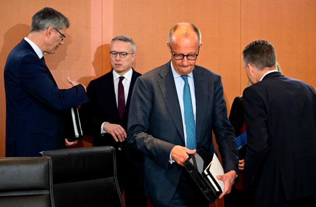 (L-R) German Transport Minister Patrick Schnieder, German Minister for Digitalization and State Modernization Karsten Wildberger, German Chancellor Friedrich Merz and Chief of Staff and Minister for Special Tasks Thorsten Frei arrive for the weekly cabinet meeting at the Chancellery in Berlin on June 3, 2026. (Photo by Tobias SCHWARZ / AFP)