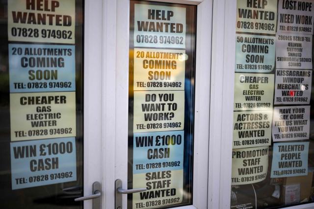 Advertisements for job opportunities and financial enticements are displayed in the windows of a shop in Blackpool, north-west England on June 2, 2026. (Photo by Oli SCARFF / AFP)