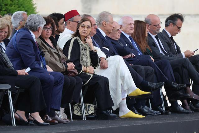 Moroccan sociologist Sabah Abouessalam (C), widow of Edgar Morin, attends  a national tribute to late French philosopher and sociologist Edgar Morin at the Hotel des Invalides in Paris on June 2, 2026. Edgar Morin has died at the age of 104, on May 29, 2026. (Photo by Ludovic MARIN / AFP)
