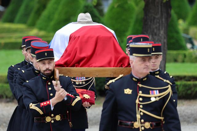 Republican Guards carry the coffin during a national tribute to late French philosopher and sociologist Edgar Morin at the Hotel des Invalides in Paris on June 2, 2026. Edgar Morin has died at the age of 104, on May 29, 2026. (Photo by Ludovic MARIN / AFP)