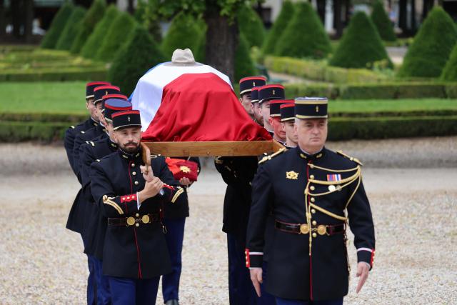Republican Guards carry the coffin during a national tribute to late French philosopher and sociologist Edgar Morin at the Hotel des Invalides in Paris on June 2, 2026. Edgar Morin has died at the age of 104, on May 29, 2026. (Photo by Ludovic MARIN / AFP)