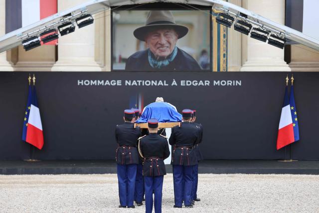 Republican Guards carry the coffin during a national tribute to late French philosopher and sociologist Edgar Morin at the Hotel des Invalides in Paris on June 2, 2026. Edgar Morin has died at the age of 104, on May 29, 2026. (Photo by Ludovic MARIN / AFP)