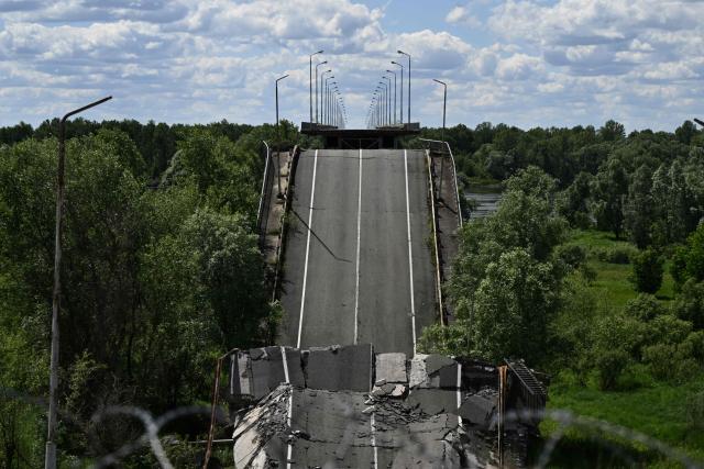 This photograph shows the destroyed bridge over the Dnipro River, which forms the state border between Ukraine and Belarus in the Chernigiv region, on June 1, 2026, amid the Russian invasion of Ukraine. (Photo by Genya SAVILOV / AFP)