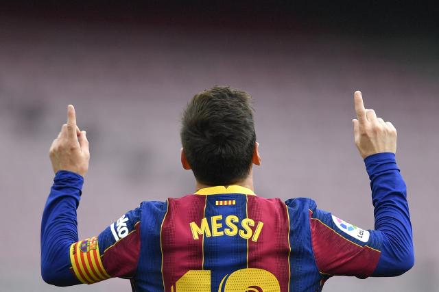 (FILES) Barcelona's Argentine forward Lionel Messi celebrates scoring a goal during the Spanish League football match between FC Barcelona  and RC Celta de Vigo at the Camp Nou stadium in Barcelona on May 16, 2021. The football legend Lionel Messi won the Princess of Asturias Award for Sports this Wednesday in Spain, which highlighted the Argentines "humility" on the field and his work off it on behalf of "the most underprivileged children." Messi, "the player who has won the most titles in the history of football, has also earned the respect and admiration of everyone for his exemplary behavior on the field and for his perseverance, humility, and commitment to team play," the jury stated in its decision. (Photo by Pau BARRENA / AFP)
