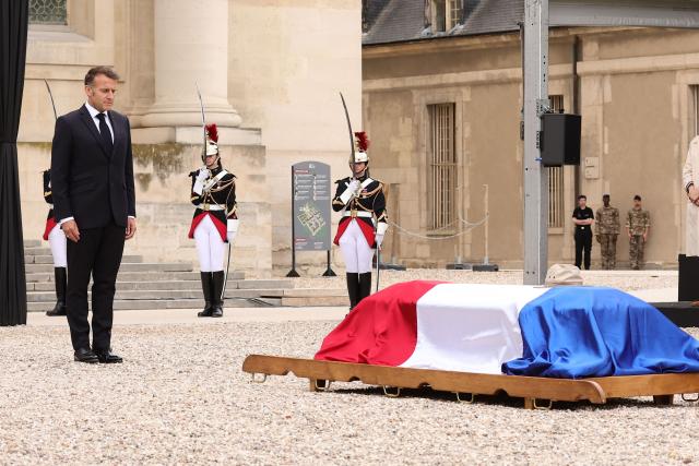 France's President Emmanuel Macron observes a minute of silence during a national tribute to late French philosopher and sociologist Edgar Morin at the Hotel des Invalides in Paris on June 2, 2026. Edgar Morin has died at the age of 104, on May 29, 2026. (Photo by Teresa Suarez / POOL / AFP)