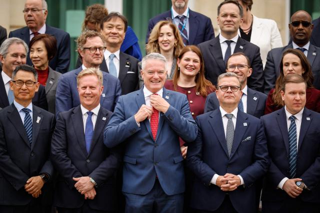Attendees including Secretary-General of the Organisation for Economic Co-operation and Development (OECD) Mathias Cormann (C) pose during a family photograph at the OECD 2026 Ministerial Council Meeting (MCM) at the Organisation for Economic Co-operation and Development (OECD) headquarters in Paris on June 3, 2026. (Photo by SIMON WOHLFAHRT / AFP)