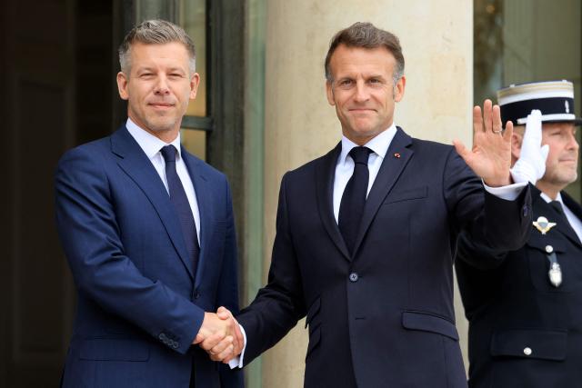 France's President Emmanuel Macron (R) gestures as he welcomes Hungary's Prime Minister Peter Magyar at The Elysee Presidential Palace in Paris on June 3, 2026. (Photo by Ludovic MARIN / AFP)
