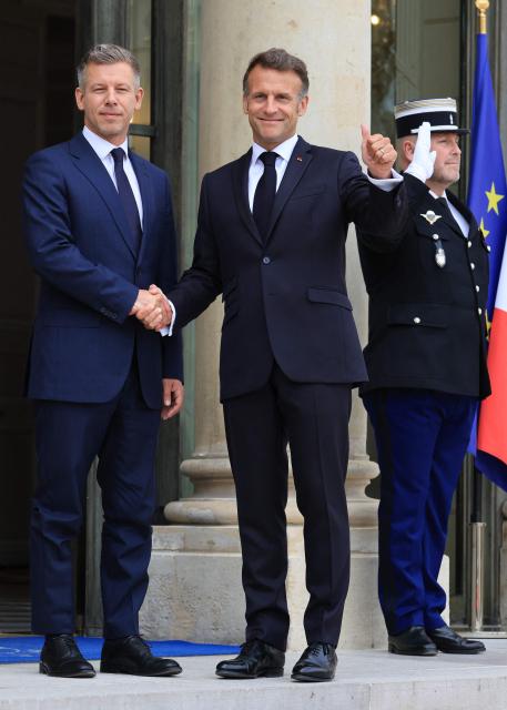 France's President Emmanuel Macron (R) welcomes Hungary's Prime Minister Peter Magyar at The Elysee Presidential Palace in Paris on June 3, 2026. (Photo by Ludovic MARIN / AFP)