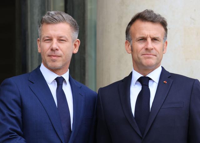 France's President Emmanuel Macron (R) welcomes Hungary's Prime Minister Peter Magyar ahead of a meeting at The Elysee Presidential Palace in Paris on June 3, 2026. (Photo by Ludovic MARIN / AFP)