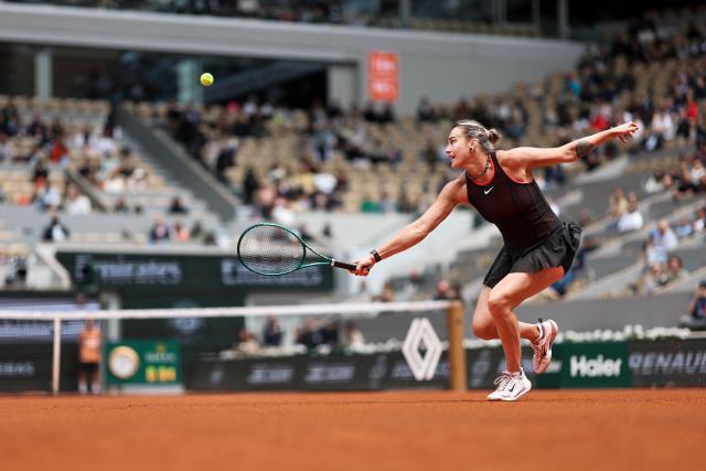 Aryna Sabalenka plays a backhand return to Diana Shnaider during their women's quarter final singles match on day 11 of the French Open tennis tournament on Court Philippe-Chatrier at the Roland-Garros Complex in Paris on June 3, 2026. (Photo by Anne-Christine POUJOULAT / AFP)