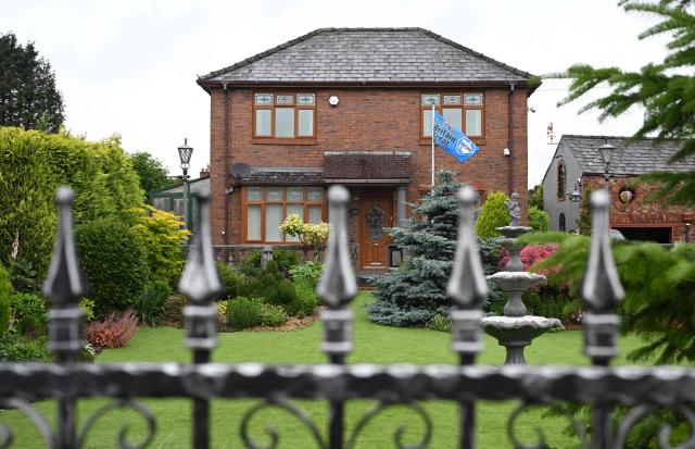 A flag promoting the Reform UK political party is pictured in the garden of a residential property in Ashton-in-Makerfield, west of Manchester in north-west England on June 03, 2026, ahead of the Makerfield by-election. The Makerfield by-election, set to be held on June 18, may see Greater Manchester mayor Andy Burnham return to the government though he would face a tough fight from the poll-topping Reform UK. (Photo by Oli SCARFF / AFP)
