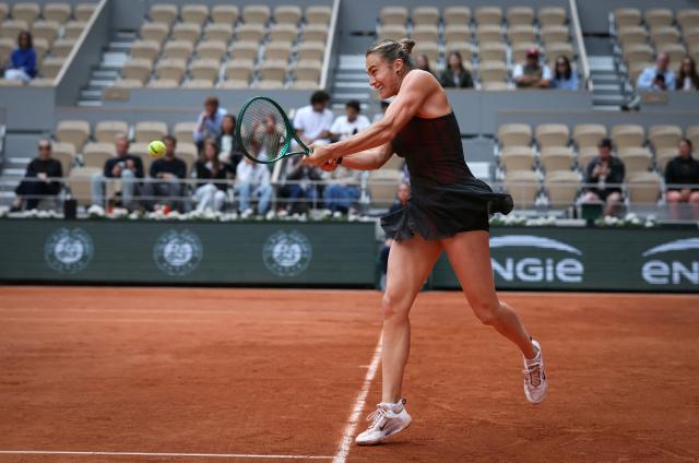 Aryna Sabalenka plays a backhand return to Diana Shnaider during their women's quarter final singles match on day 11 of the French Open tennis tournament on Court Philippe-Chatrier at the Roland-Garros Complex in Paris on June 3, 2026. (Photo by Alain JOCARD / AFP)