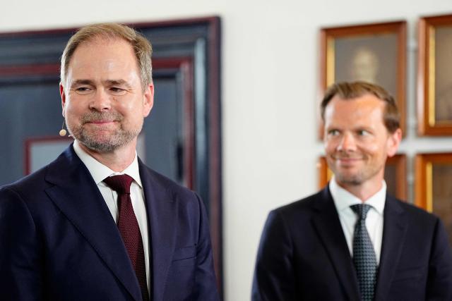 Outgoing Denmark's Ministry of Finance Nicolai Wammen (L) and incoming Denmark's Ministry of Finance Peter Hummelgaard (R) react during the handover in Copenhagen, Denmark, on June 3, 2026. Following months of talks after inconclusive elections in March 2026, incumbent Frederiksen said on June 1, 2026 she had managed to form a minority government between her Social Democrats, the Socialist People's Party, the centre-left Radikale Venstre and the centrist Moderates. (Photo by Mads Claus Rasmussen / Ritzau Scanpix / AFP) / Denmark OUT