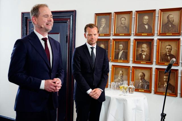 Outgoing Denmark's Ministry of Finance Nicolai Wammen (L) and incoming Denmark's Ministry of Finance Peter Hummelgaard (R) are pictured during the handover in Copenhagen, Denmark, on June 3, 2026. Following months of talks after inconclusive elections in March 2026, incumbent Frederiksen said on June 1, 2026 she had managed to form a minority government between her Social Democrats, the Socialist People's Party, the centre-left Radikale Venstre and the centrist Moderates. (Photo by Mads Claus Rasmussen / Ritzau Scanpix / AFP) / Denmark OUT