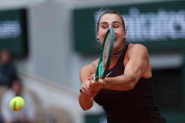 Aryna Sabalenka plays a backhand return to Diana Shnaider during their women's quarter final singles match on day 11 of the French Open tennis tournament on Court Philippe-Chatrier at the Roland-Garros Complex in Paris on June 3, 2026. (Photo by ALAIN JOCARD / AFP)