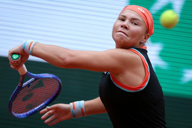 Diana Shnaider plays a forehand return to Aryna Sabalenka during their women's quarter final singles match on day 11 of the French Open tennis tournament on Court Philippe-Chatrier at the Roland-Garros Complex in Paris on June 3, 2026. (Photo by Alain JOCARD / AFP)