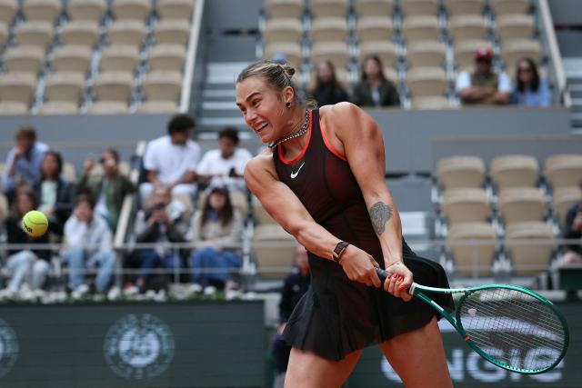Aryna Sabalenka plays a backhand return to Diana Shnaider during their women's quarter final singles match on day 11 of the French Open tennis tournament on Court Philippe-Chatrier at the Roland-Garros Complex in Paris on June 3, 2026. (Photo by Alain JOCARD / AFP)