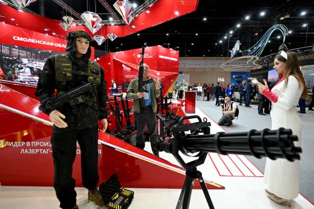 Participants tour an exhibition of the St. Petersburg International Economic Forum (SPIEF) in Saint Petersburg on June 3, 2026. (Photo by Olga MALTSEVA / AFP)