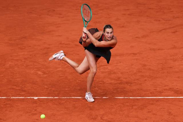 Aryna Sabalenka plays a backhand return to Diana Shnaider during their women's quarter final singles match on day 11 of the French Open tennis tournament on Court Philippe-Chatrier at the Roland-Garros Complex in Paris on June 3, 2026. (Photo by Anne-Christine POUJOULAT / AFP)