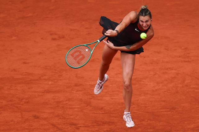 Aryna Sabalenka serves to Diana Shnaider during their women's quarter final singles match on day 11 of the French Open tennis tournament on Court Philippe-Chatrier at the Roland-Garros Complex in Paris on June 3, 2026. (Photo by Anne-Christine POUJOULAT / AFP)