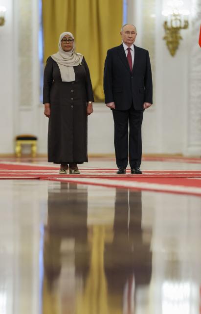 Russia's President Vladimir Putin and his Tanzania's counterpart Samia Suluhu Hassan attend a meeting at the Kremlin in Moscow on June 3, 2026. (Photo by Ramil Sitdikov / POOL / AFP)