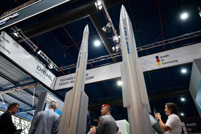 Visitors inspect IRIS-T SLM and IRIS-T SLX missiles during the International Defence, Equipment and Services Exhibition "HEMUS 2026", in Plovdiv on June 3, 2026. The exhibition runs from June 3 to 6 ??? features 216 companies and organizations from 28 countries. (Photo by Nikolay DOYCHINOV / AFP)