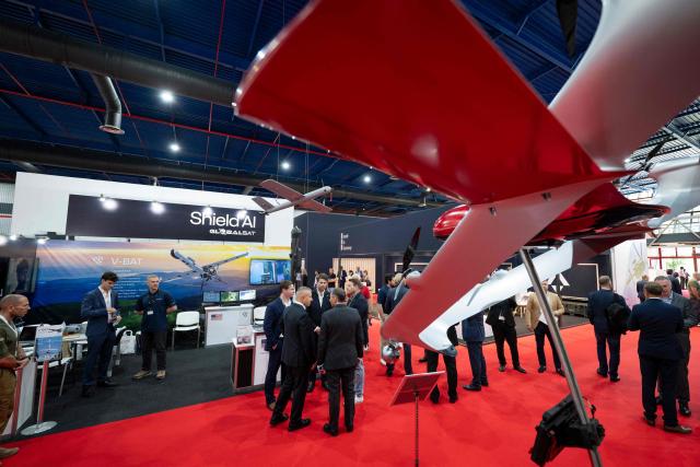 Visitors inspect drones of US aerospace and defense technology company Shield AI  during the International Defence, Equipment and Services Exhibition "HEMUS 2026", in Plovdiv on June 3, 2026. The exhibition runs from June 3 to 6 ??? features 216 companies and organizations from 28 countries. (Photo by Nikolay DOYCHINOV / AFP)