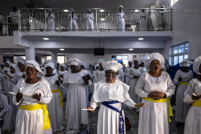 Worshippers pray during a service at the Celestial Church of Christ International Headquarters in the Ketu neighbourhood of Lagos, on June 3, 2026. (Photo by OLYMPIA DE MAISMONT / AFP)