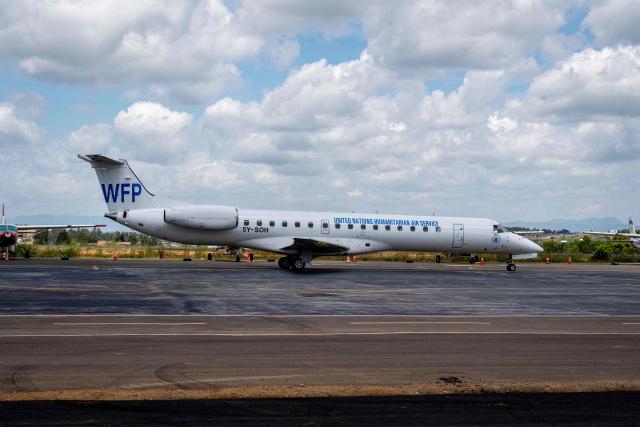 A general view of a World Food Programme (WFP) humanitarian aircraft on the tarmac at Bunia Airport in eastern Democratic Republic of the Congo on June 3, 2026. On May 23, DRC authorities announced the temporary closure of Bunia Airport, located in the capital of Ituri Province, where the 17th Ebola outbreak is raging. The airport reopened on June 2. To date, 48 deaths have been reported among 321 confirmed cases of infection, according to Congolese health authorities and the WHO. (Photo by GLODY MURHABAZI / AFP)