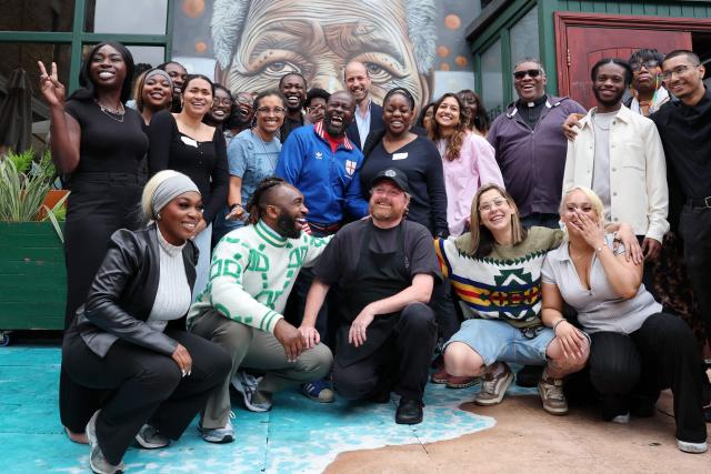Britain's Prince William, Prince of Wales poses for a photograph with staff and members of the community outside The Prince of Peckham Pub in Peckham, south east London on June 3, 2026, the pub has become a hub for local communities, hosting  events and initiatives aimed at fostering connection and combatting loneliness. (Photo by Chris Jackson / POOL / AFP)