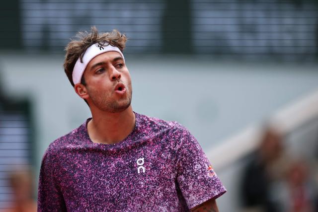 Italy's Flavio Cobolli reacts to a point against Canada's Felix Auger-Aliassime during their men's quarter final singles match on day 11 of the French Open tennis tournament on Court Philippe-Chatrier at the Roland-Garros Complex in Paris on June 3, 2026. (Photo by Anne-Christine POUJOULAT / AFP)