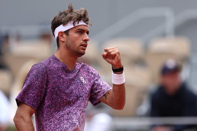 Italy's Flavio Cobolli reacts to a point against Canada's Felix Auger-Aliassime during their men's quarter final singles match on day 11 of the French Open tennis tournament on Court Philippe-Chatrier at the Roland-Garros Complex in Paris on June 3, 2026. (Photo by Anne-Christine POUJOULAT / AFP)