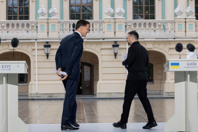 Ukraine's President Volodymyr Zelensky (R) and NATO Secretary General Mark Rutte (L) speak as they leave after addressing media representatives at a press conference in Kyiv on June 3, 2026, amid the Russian invasion of Ukraine. (Photo by Tetiana DZHAFAROVA / AFP)
