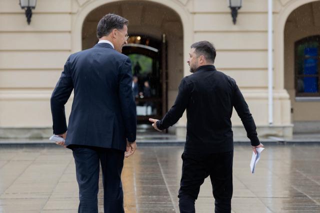 Ukraine's President Volodymyr Zelensky (R) and NATO Secretary General Mark Rutte (L) speak as they leave after addressing media representatives at a press conference in Kyiv on June 3, 2026, amid the Russian invasion of Ukraine. (Photo by Tetiana DZHAFAROVA / AFP)