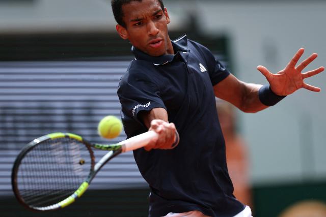 Canada's Felix Auger-Aliassime plays a forehand return to Italy's Flavio Cobolli during their men's quarter final singles match on day 11 of the French Open tennis tournament on Court Philippe-Chatrier at the Roland-Garros Complex in Paris on June 3, 2026. (Photo by Anne-Christine POUJOULAT / AFP)