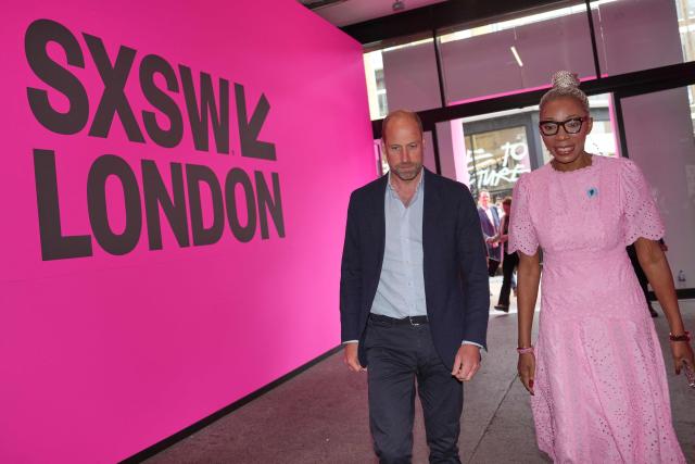 Britain's Prince William, Prince of Wales speaks with CEO of The Diana Award Tessy Ojo at The Diana Award charity during the SXSW (South by Southwest) Festival, in Shoreditch, east London on June 3, 2026. (Photo by Kin CHEUNG / POOL / AFP)